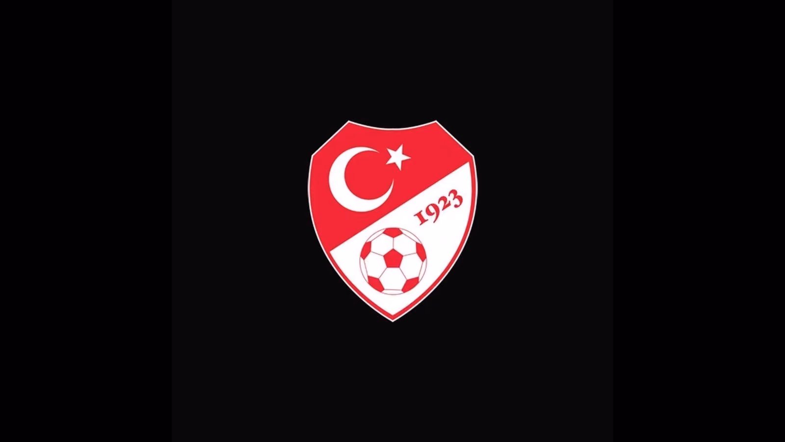 Kırmızı beyaz kalkan içinde ay yıldız, altında futbol topu ve 1923 yazılı TFF logosu, siyah zeminde.
